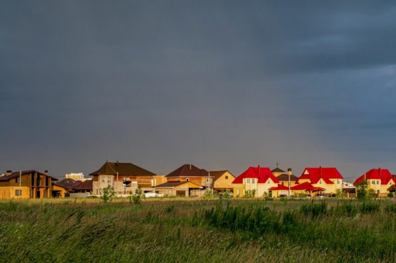 horizontal-shot-colorful-houses-cloudy-sky